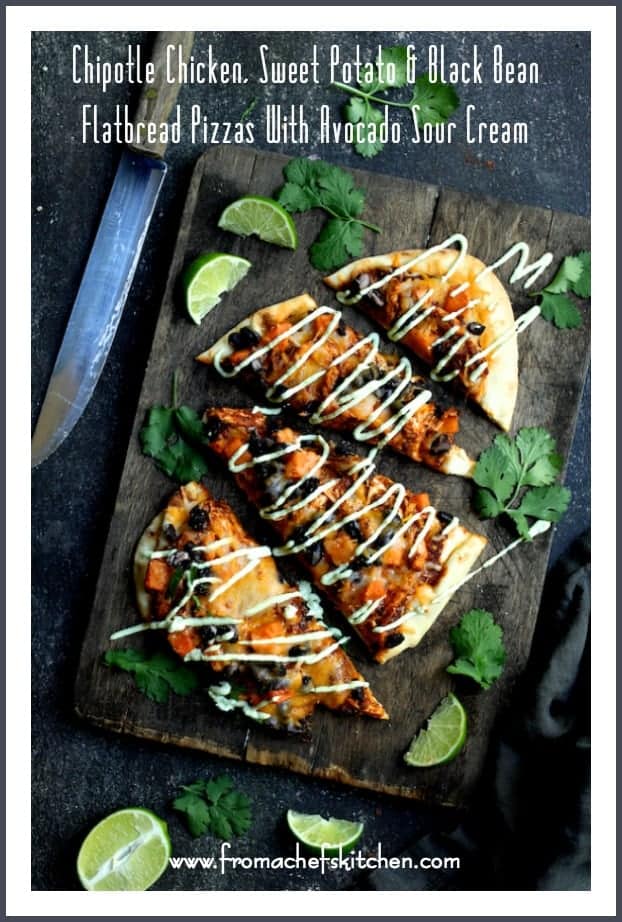 Pinterest graphic for Chipotle Chicken, Sweet Potato and Black Bean Flatbread Pizzas with Avocado Sour Cream showing one sliced into four pieces on wooden cutting board.