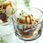 Grilled Peaches with Vanilla Ice Cream and Honey Balsamic Drizzle in dessert glasses.