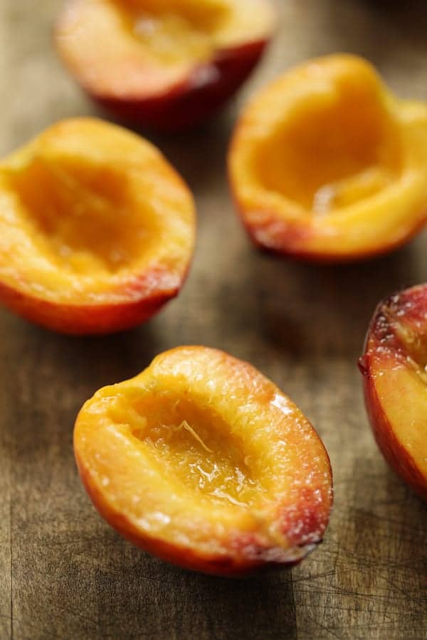Photo of peaches after being halved and pitted.