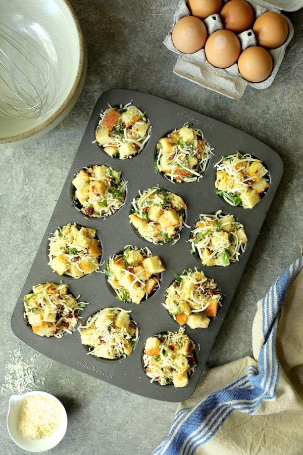 Photo of stratas in muffin pan before custard is added.