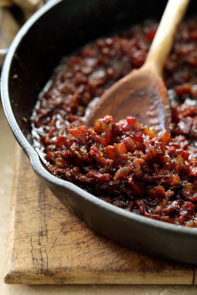 Close-up photo of bacon jam in cast iron skillet.
