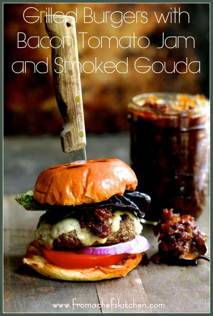 Pinterest graphic for Grilled Burgers with Bacon Tomato Jam and Smoked Gouda showing the burger with a steak knife through it and the jar of jam.