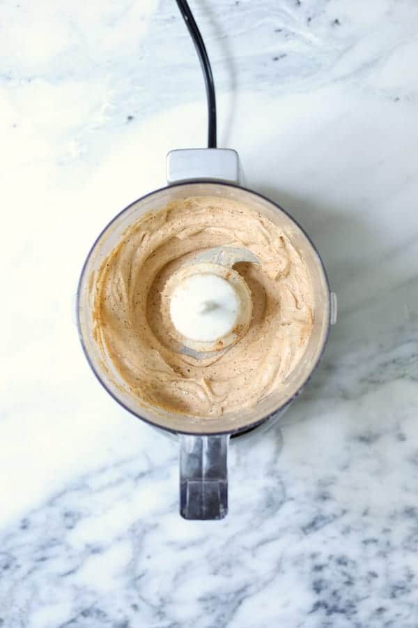 Photo of goat cheese butter in food processor.
