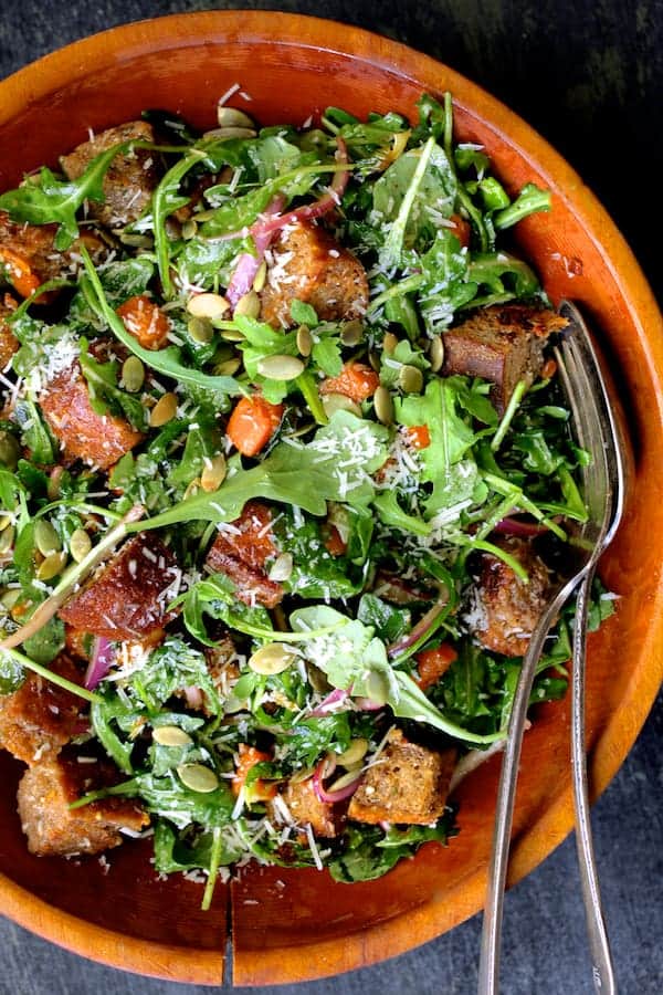 Close-up photo of Autumn Panzanella in wood bowl.
