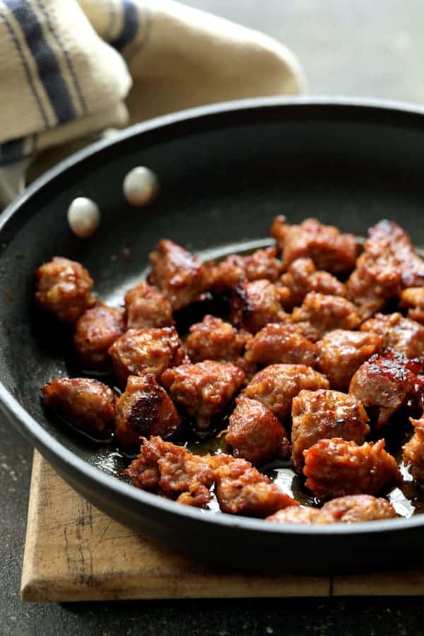 Photo of cooked Italian sausage in skillet.