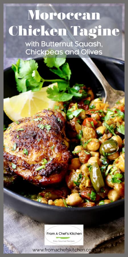 One serving of Moroccan Chicken Tagine in serving bowl garnished with lemon wedge.