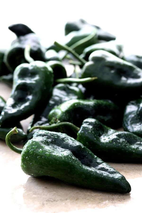 Photo of freshly washed Poblano peppers.