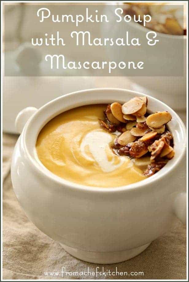 Pinterest graphic for Pumpkin Soup with Marsala and Mascarpone in white bowl garnished with sugared almonds.