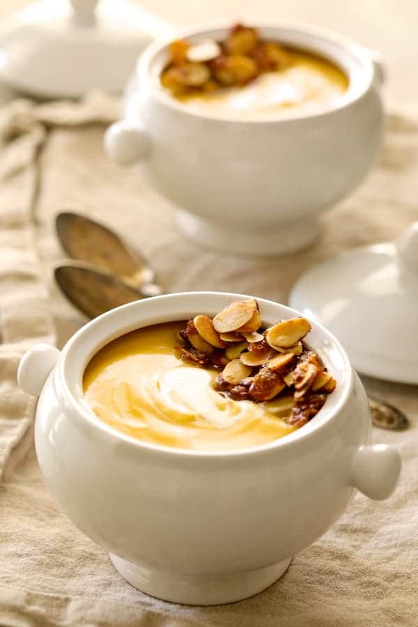 Photo of Pumpkin Soup with Marsala and Mascarpone in white bowls.