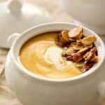 Pumpkin Soup with Marsala and Mascarpone in bowl with almond topping.