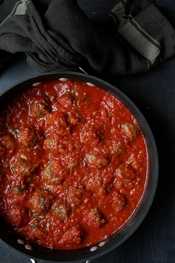 Photo of Middle Eastern Meatballs in Tomato Sauce in saucepan.