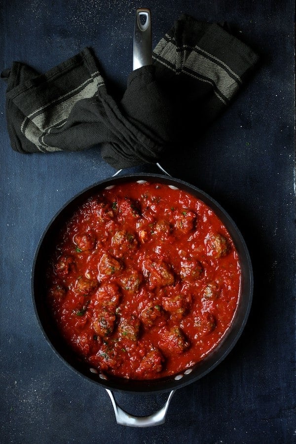 Photo of Middle Eastern Meatballs in Tomato Sauce in saucepan.