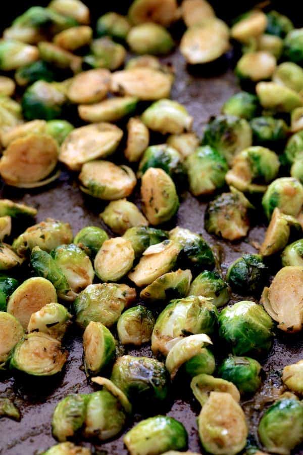 Photo of roasted Brussels sprouts on a baking sheet.
