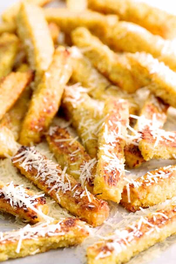 Close-up photo of a messy pile of Spaghetti Squash Fries sprinkled with Parmesan cheese.