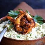 Cauliflower Gouda Grits and Blackened Shrimp in earthenware bow.