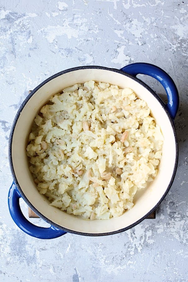 Photo of cooked cauliflower and white beans ready to be pureed.