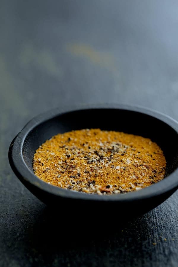 Photo of spice rub for pork medallions in black bowl.
