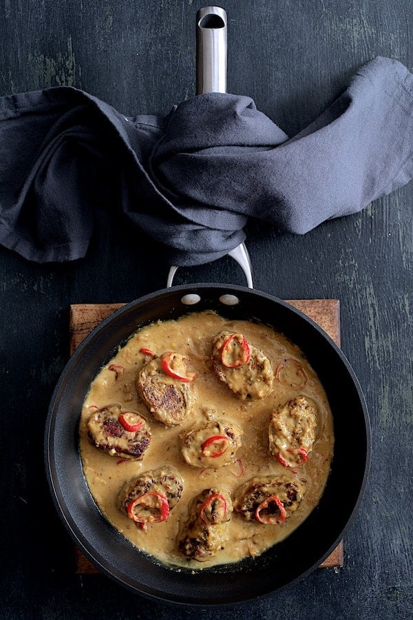 Photo of Spicy Tahini Pork Medallions in skillet.