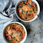 Two bowls Chicken in Rosa Sauce with Roasted Red Bell Pepper and Spinach in white serving bowls.