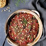 Turkish Eggplant Casserole - Imam Bayildi - in round earthenware baking dish.