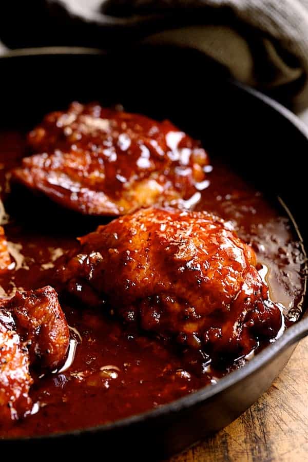 Photo of Korean Braised Chicken Thighs in cast iron skillet.