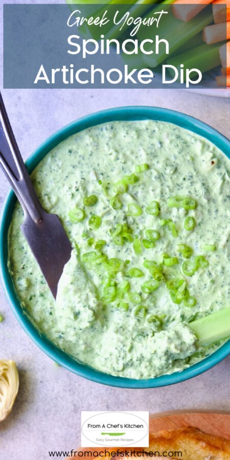 Pinterest graphic for Spinach Artichoke Dip No Mayo showing it in a bright blue bowl with carrot sticks, celery sticks and toasted baguette slices.
