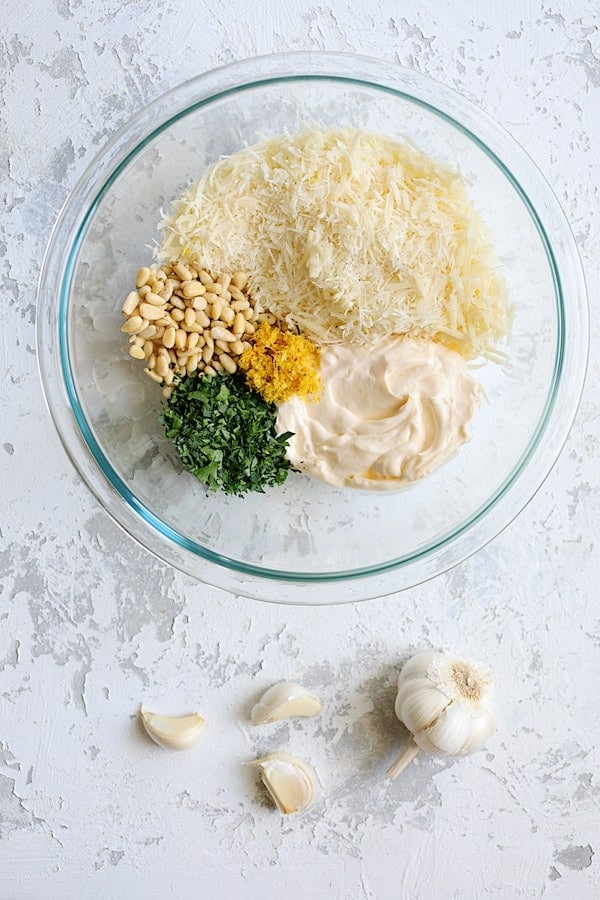 Photo of ingredients for Lemon Parmesan Stuffed Artichoke Bottoms in glass bowl.
