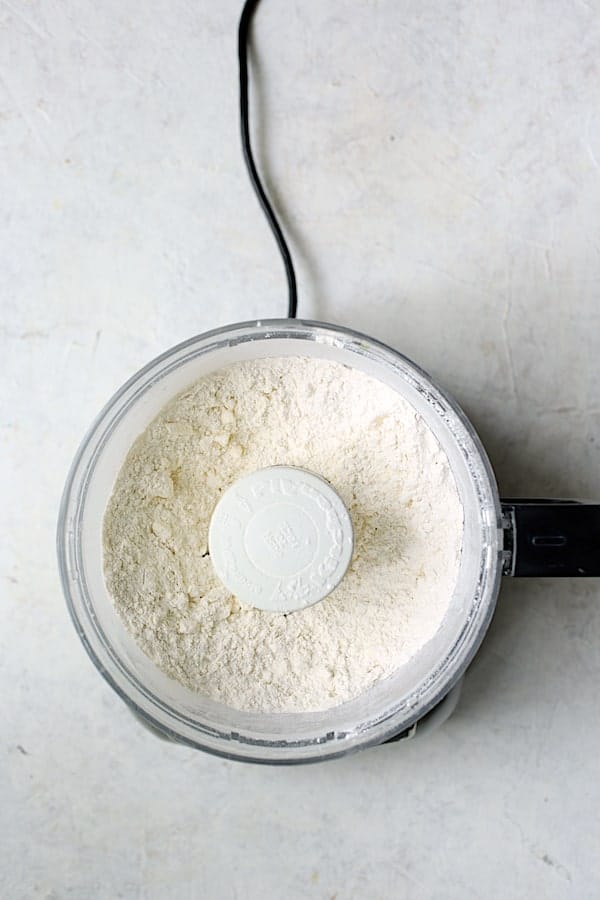 Photo of flour and butter combination in food processor.