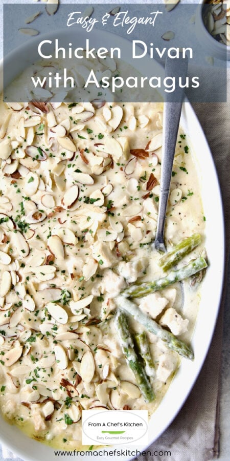 Chicken Divan with Asparagus in oval baking dish with serving spoon.