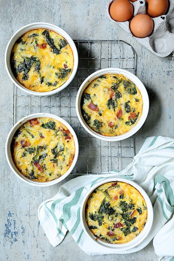 Photo of baked Hash Brown Frittata with Kale, Bacon and Cheddar on cooling rack.