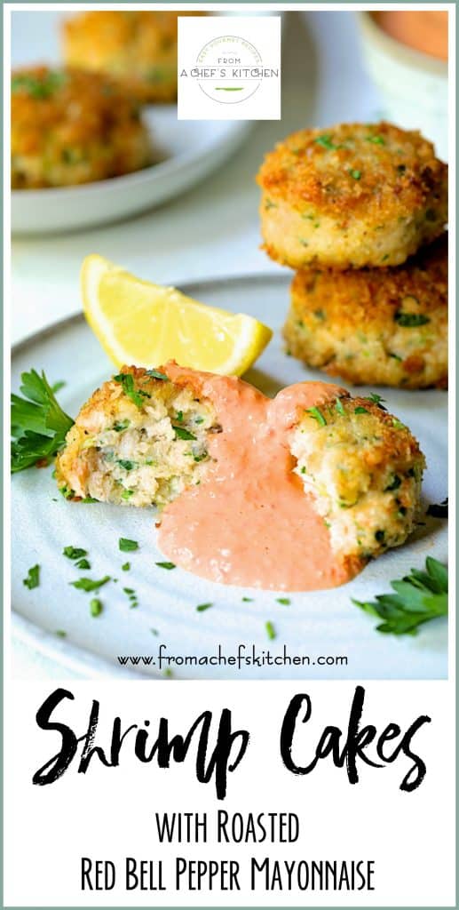 Pinterest graphic for Shrimp Cakes with Roasted Red Bell Pepper Mayonnaise showing one on a white plate cut in half with mayonnaise spooned on top.