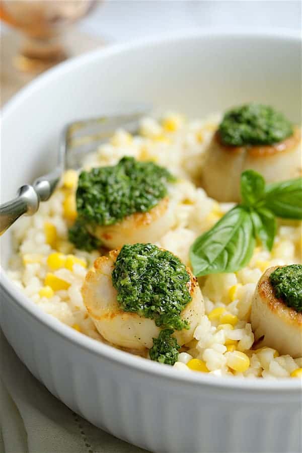 Close-up photo of Sweet Corn Risotto with Seared Sea Scallops and Basil Salsa Verde.