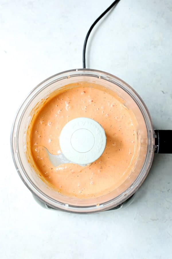 Photo of roasted red bell pepper mayonnaise in food processor.