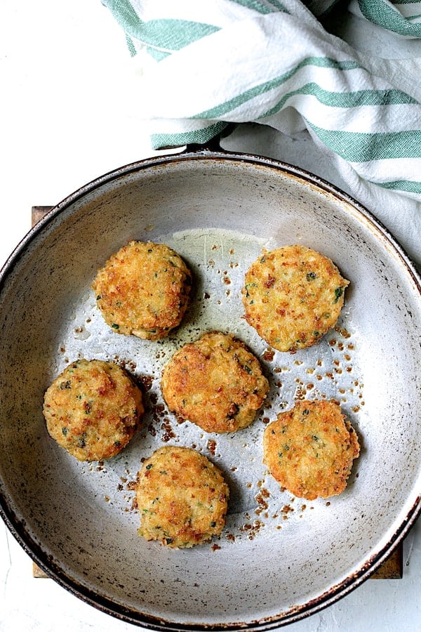 Photo of fried shrimp cakes in skillet.