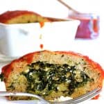 Slice of Spinach and Feta-Stuffed Turkey Meatloaf on white plate.