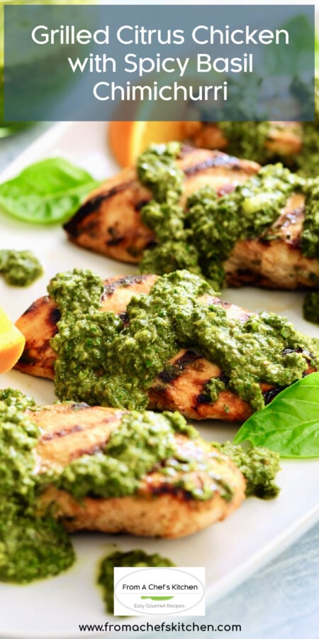 Pinterest graphic for Grilled Citrus Chicken with Spicy Basil Chimichurri showing it on an oval white platter garnished with orange wedges and basil leaves.