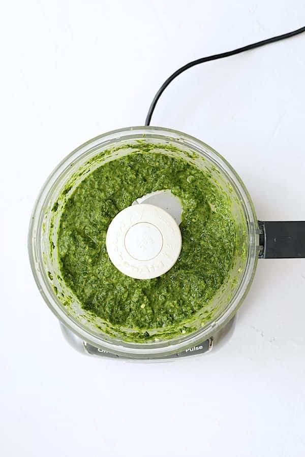 Photo of spicy basil chimichurri in food processor after processing.