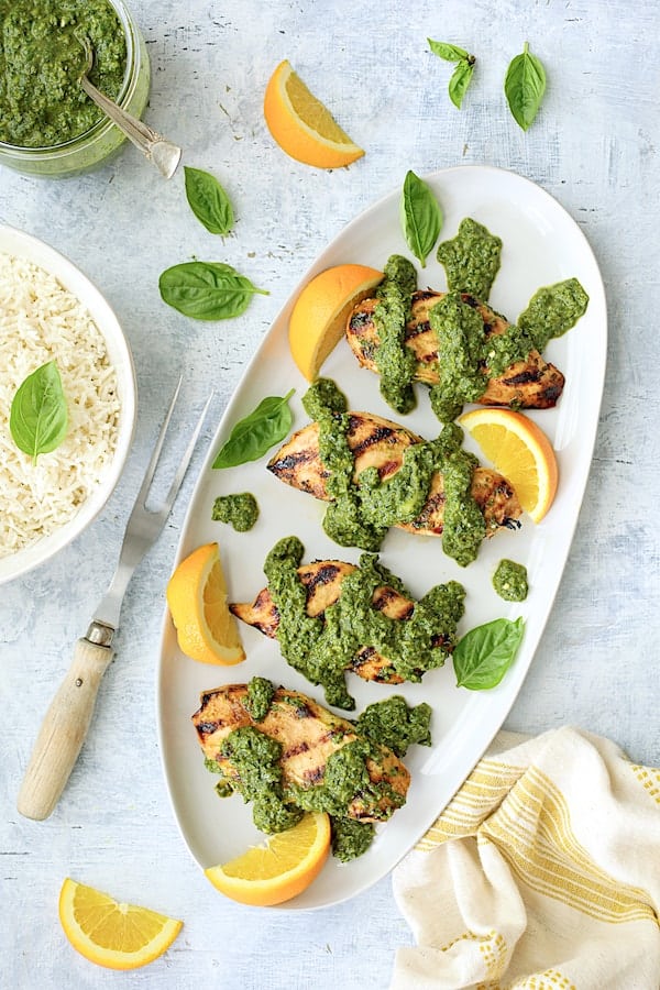 Photo of Grilled Citrus Chicken with Spicy Basil Chimichurri Sauce with rice included and serving fork.