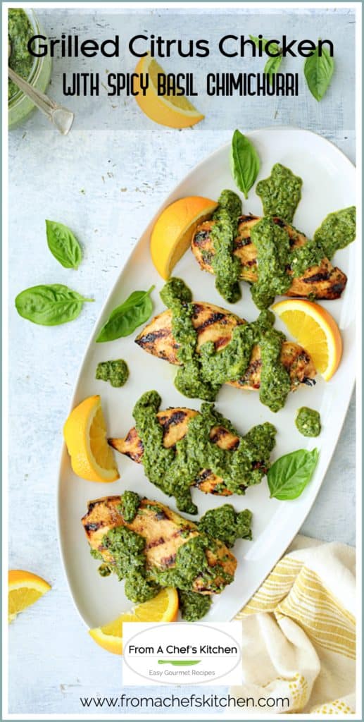 Pinterest graphic for Grilled Citrus Chicken with Spicy Basil Chimichurri showing it on an oval white platter garnished with orange wedges.