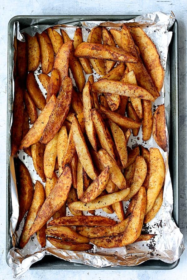 Photo of roasted potatoes on a sheet pan.