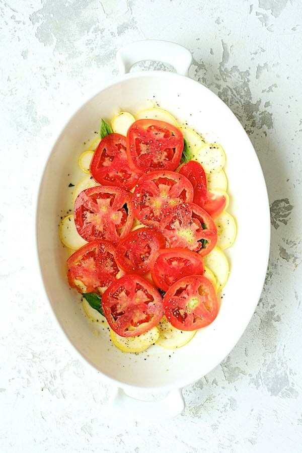 Photo of the tomato layer over the yellow squash.