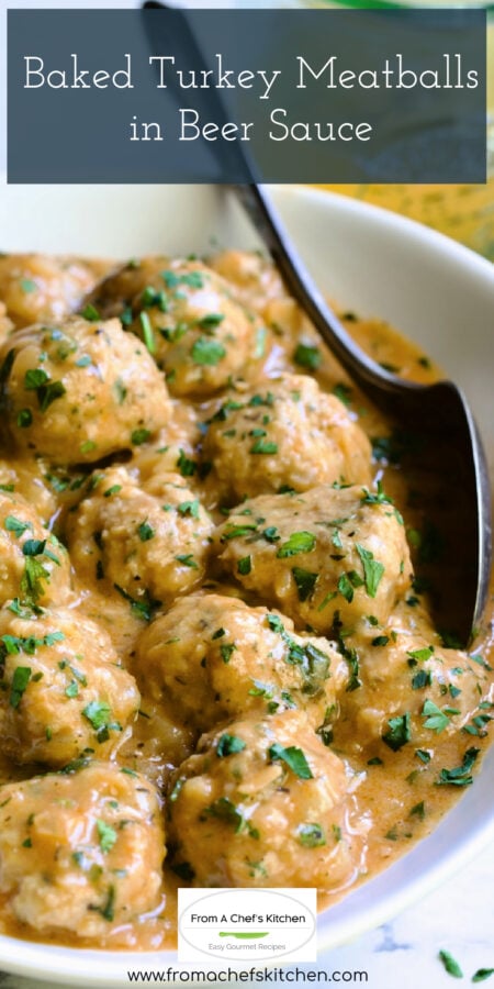 Pinterest graphic for Baked Turkey Meatballs in Beer Sauce showing them in white oval bowl with serving spoon garnished with fresh parsley.