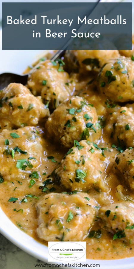 Pinterest graphic for Baked Turkey Meatballs in Beer Sauce showing them in white oval bowl with serving spoon garnished with fresh parsley.