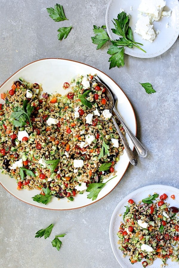 Photo of Mediterranean Farro Salad with some served on a smaller white plate.