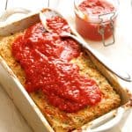 Turkey Meatloaf with Roasted Red Pepper Sauce in white loaf pan.