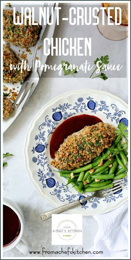 Pinterest graphic for Walnut-Crusted Chicken with Pomegranate Sauce showing one serving on a blue decorative plate.