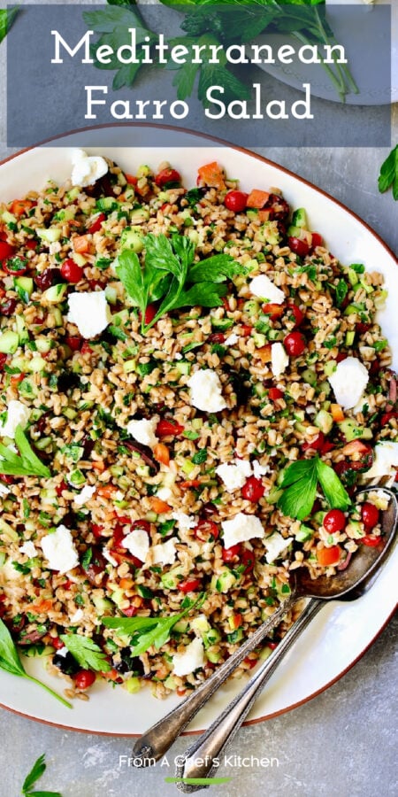 Pinterest graphic for Mediterranean Farro Salad showing it on a round white platter.