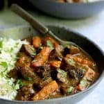 Indian Curry Beef Stew with white basmati rice in a gray bowl.