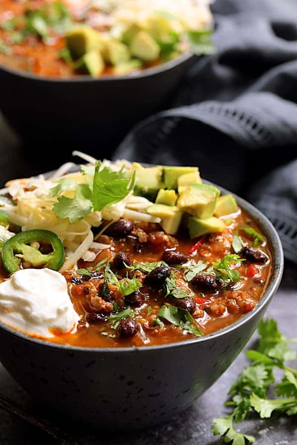 Turkey, Black Bean and Quinoa Chili - Close-up shot of the chili in gray bowl