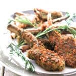 Parmesan and Herb-Crusted Lamb Chops on gray-rimmed platter.